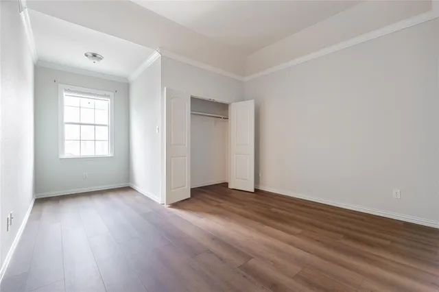 a view of a room with wooden floor