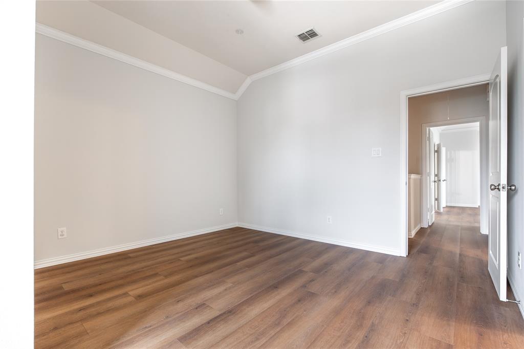 1020 Rodin Lane Carrollton, TX 75006 - Photo 17 of 25 a view of a room with wooden floor