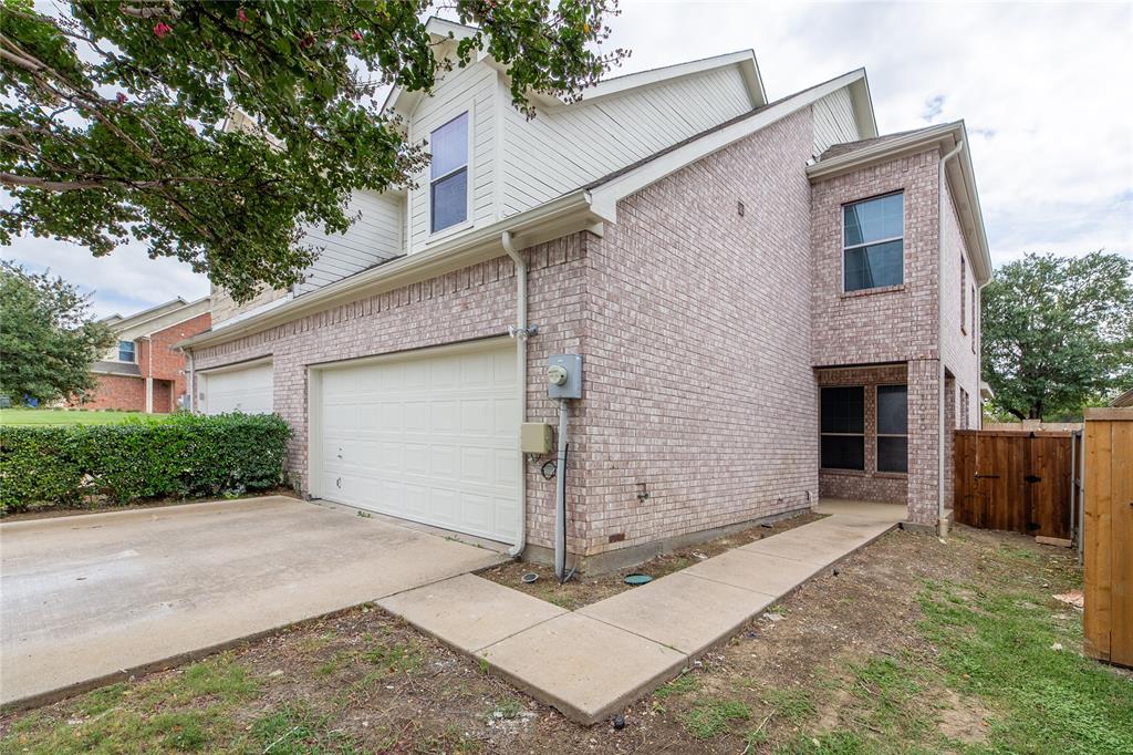 1020 Rodin Lane Carrollton, TX 75006 - Photo 24 of 25 a front view of a house with garage
