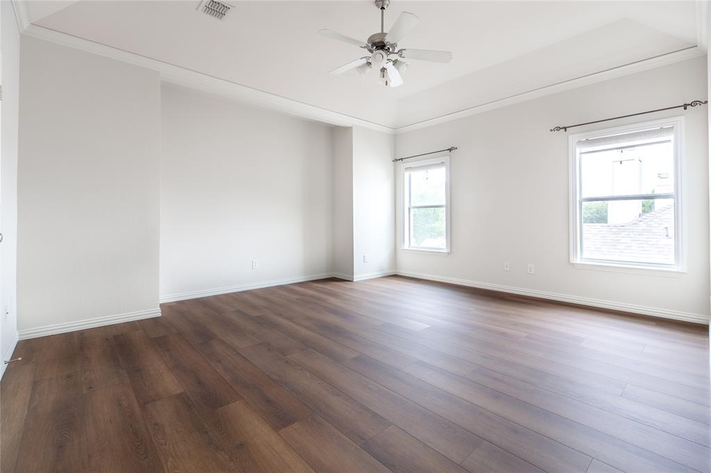 1020 Rodin Lane Carrollton, TX 75006 - Photo 9 of 25 wooden floor in an empty room with a window