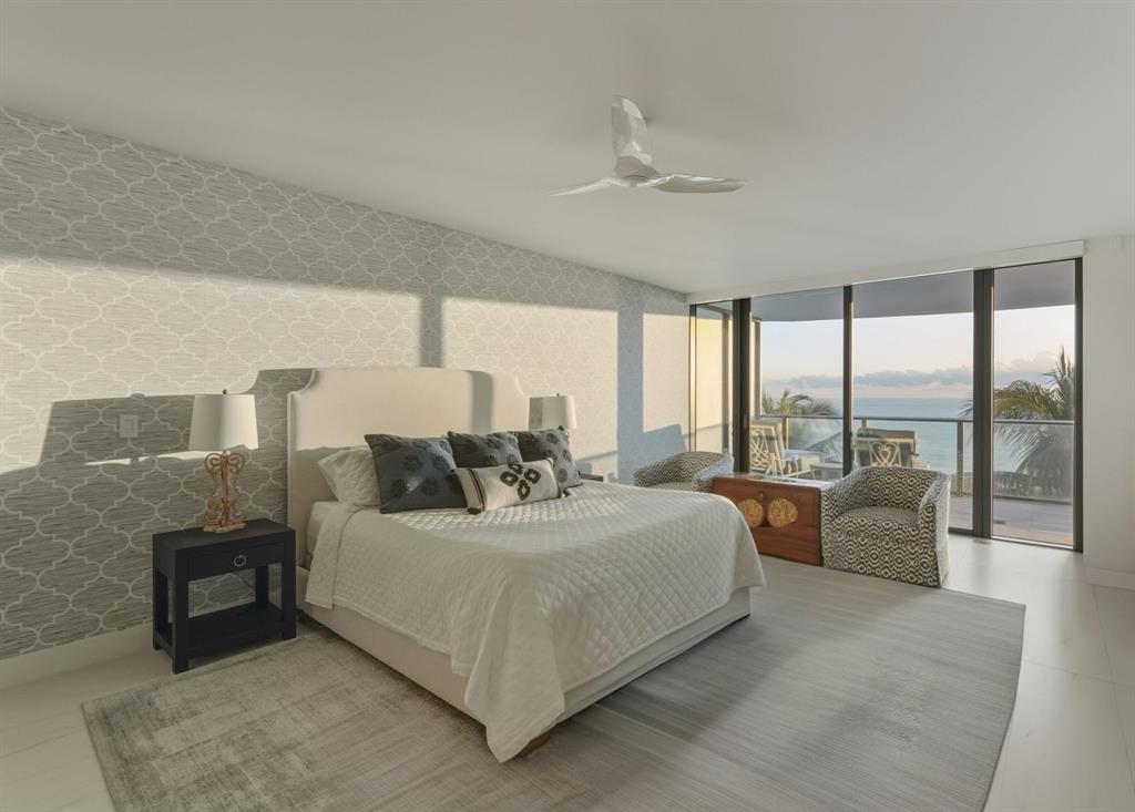 730 North Ocean Boulevard, Unit 404 Pompano Beach, FL 33062 - Photo 16 of 47 a bedroom with a bed couch and large window