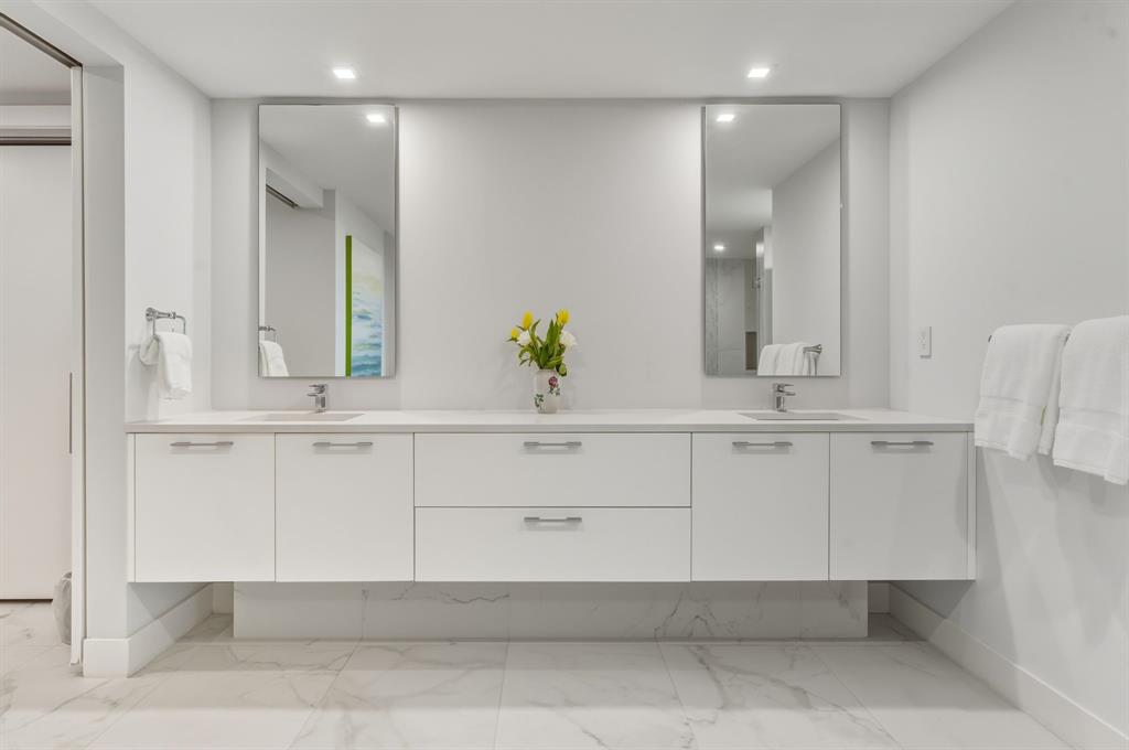 730 North Ocean Boulevard, Unit 404 Pompano Beach, FL 33062 - Photo 18 of 47 a bathroom with a sink and a mirror