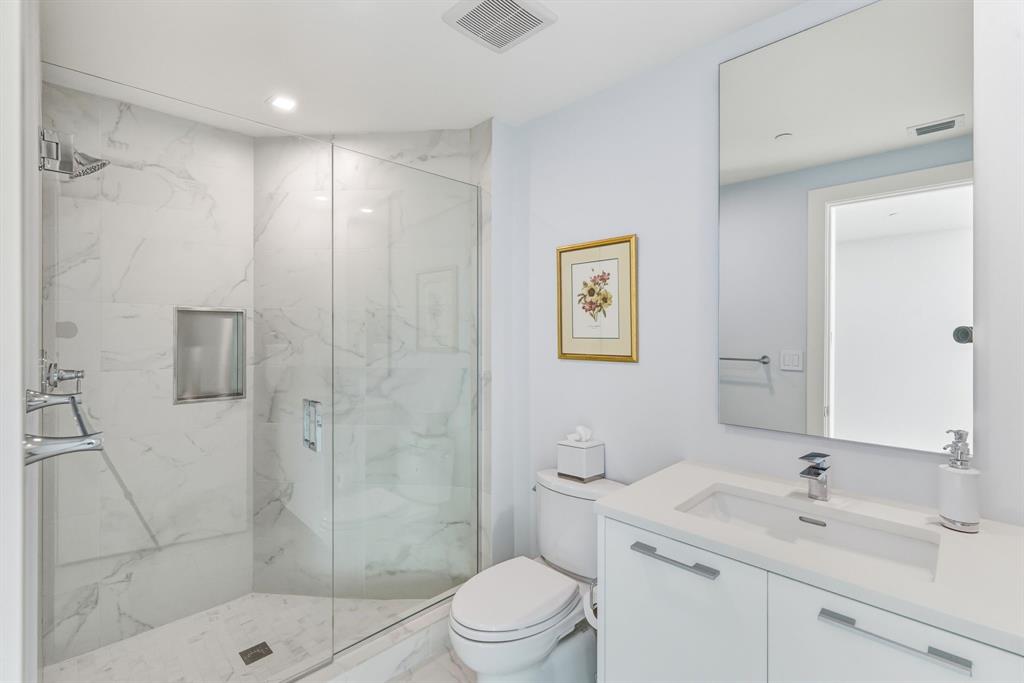 730 North Ocean Boulevard, Unit 404 Pompano Beach, FL 33062 - Photo 23 of 47 a bathroom with a sink a toilet and shower