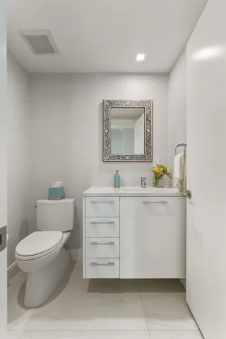 a view of a lake with a floor to ceiling window