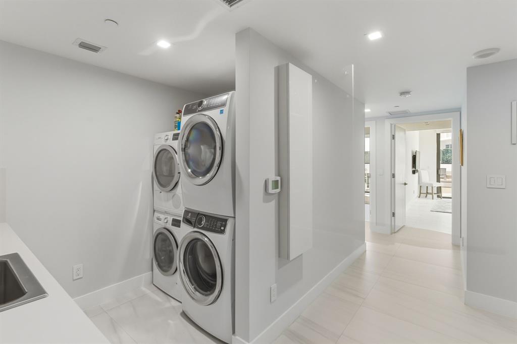730 North Ocean Boulevard, Unit 404 Pompano Beach, FL 33062 - Photo 28 of 47 a view of a storage & utility room with a washer dryer