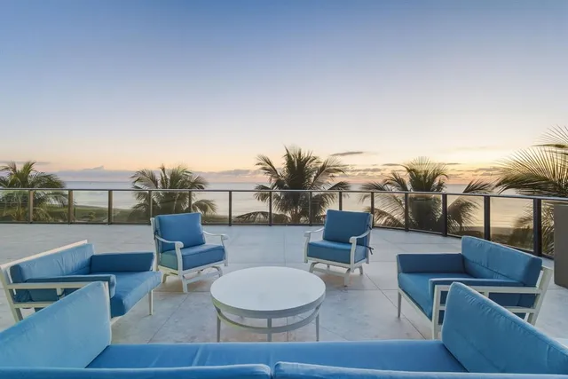 a view of outdoor space with palm trees