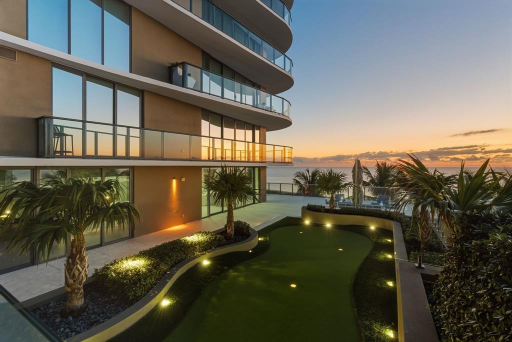 730 North Ocean Boulevard, Unit 404 Pompano Beach, FL 33062 - Photo 32 of 47 a view of a swimming pool with an outdoor seating