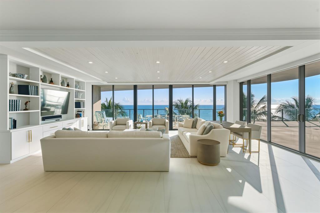 730 North Ocean Boulevard, Unit 404 Pompano Beach, FL 33062 - Photo 6 of 47 a living room with furniture and a large window