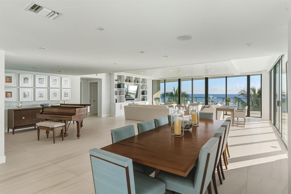 730 North Ocean Boulevard, Unit 404 Pompano Beach, FL 33062 - Photo 8 of 47 a view of a dining room with furniture and wooden floor