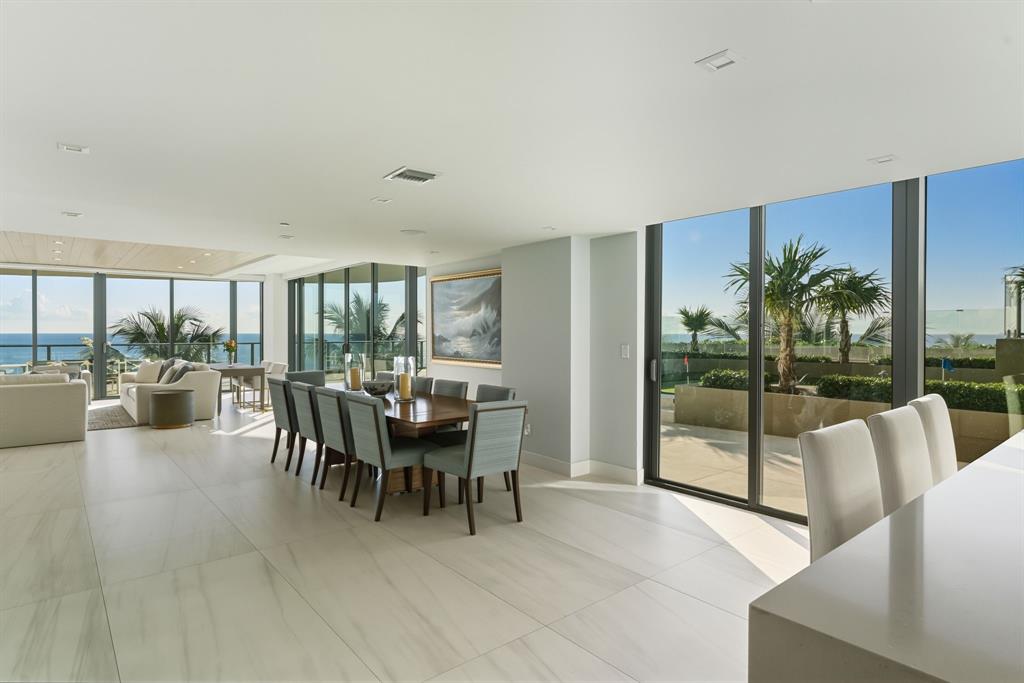 730 North Ocean Boulevard, Unit 404 Pompano Beach, FL 33062 - Photo 9 of 47 a dining room with furniture and a floor to ceiling window