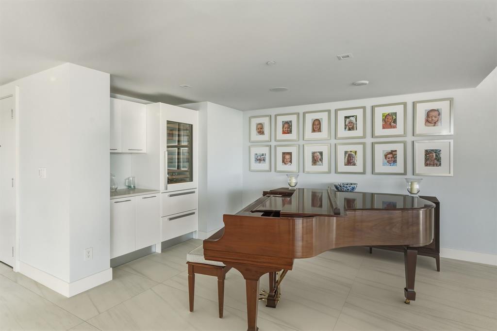 730 North Ocean Boulevard, Unit 404 Pompano Beach, FL 33062 - Photo 10 of 47 a living room with furniture and a kitchen area