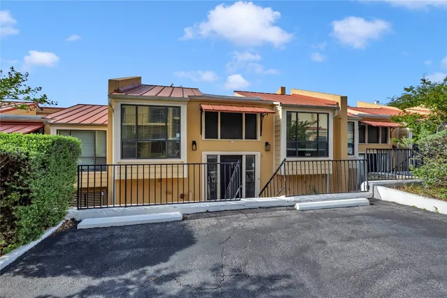 a view of a house with a iron stairs