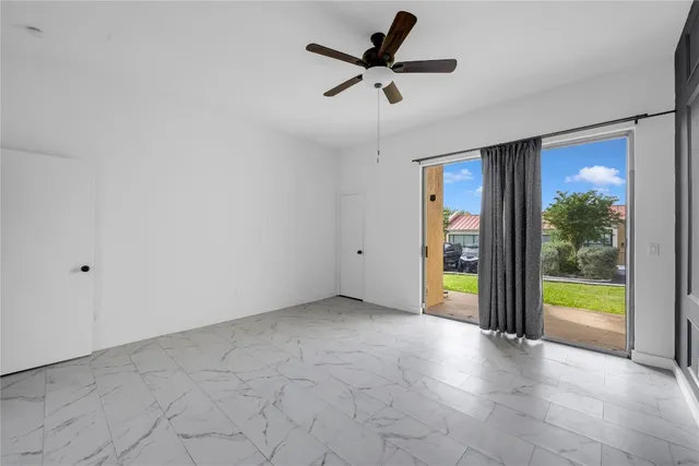 a view of an empty room with a balcony