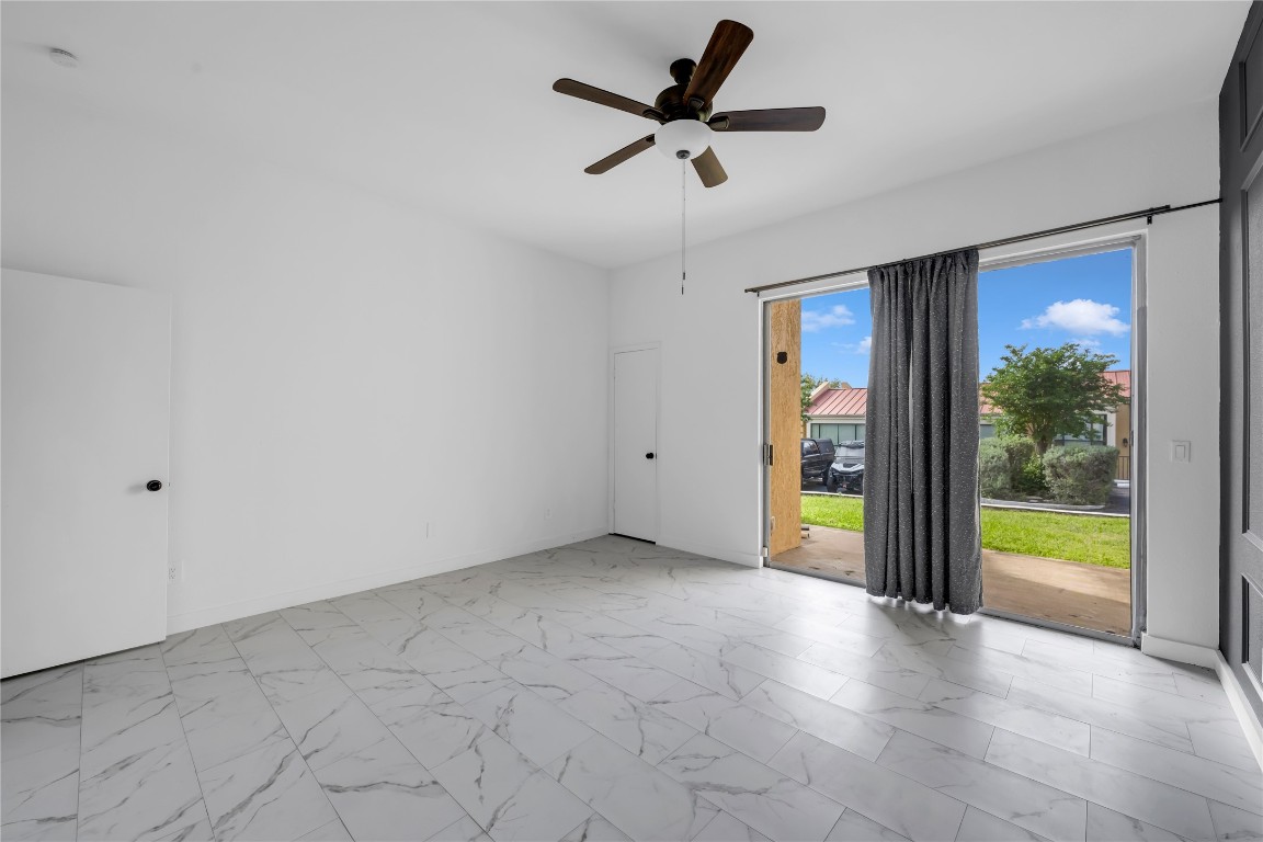 402 Hi Stirrup, Unit E2 Horseshoe Bay, TX 78657 - Photo 30 of 39 a view of an empty room with a balcony