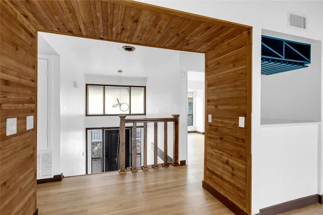 a view of entryway with wooden floor
