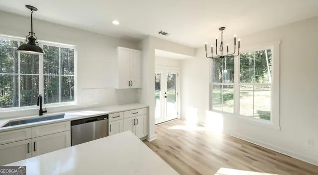 a kitchen with sink and window