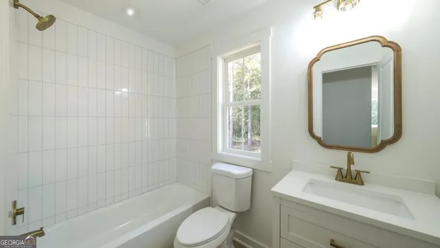 a bathroom with a sink toilet a shower and bathtub