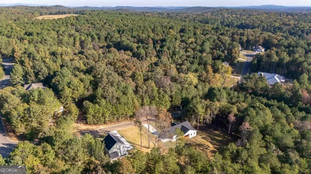an aerial view of residential house with parking space