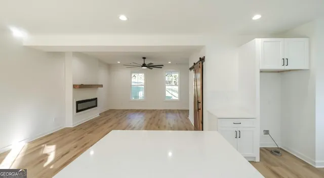 wooden floor in an empty room with a fireplace