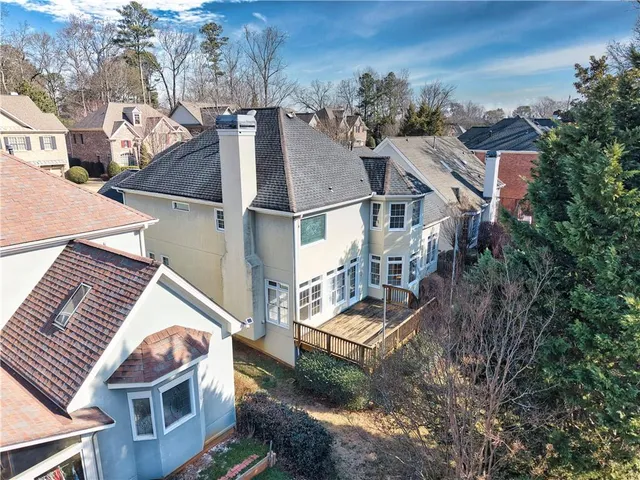 an aerial view of residential houses with outdoor space