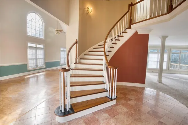 a view of entryway and hall with wooden floor