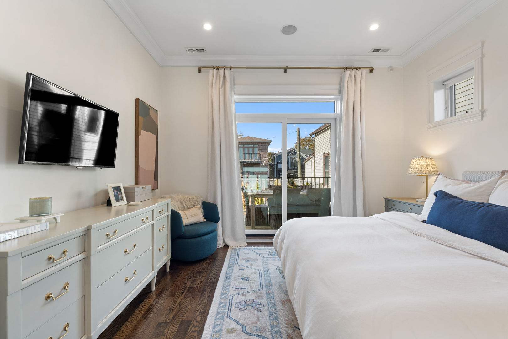 2680 North Orchard Street, Unit 2 Chicago, IL 60614 - Photo 16 of 27 a spacious bedroom with a large bed and a flat tv screen on the dresser
