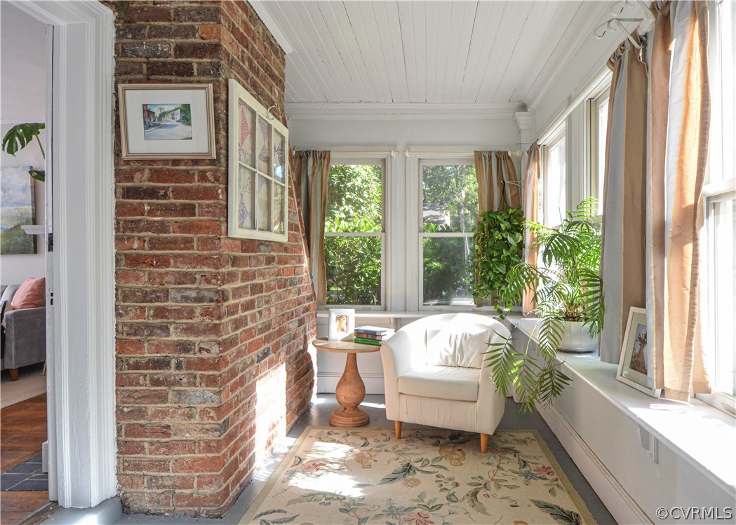 5212 Devonshire Road Richmond, VA 23225 - Photo 11 of 43 Another view of sun room with exposed brick and wa