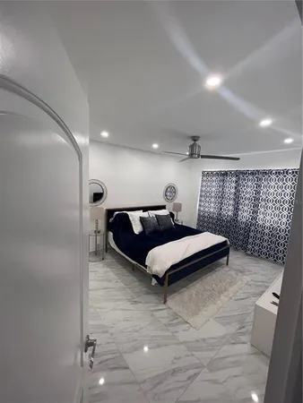 a kitchen with a sink and a mirror