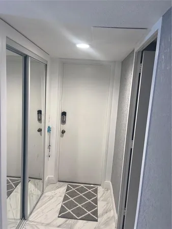 a bathroom with a granite countertop shower and a sink