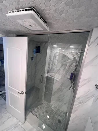 a bedroom with a bed and a mirror