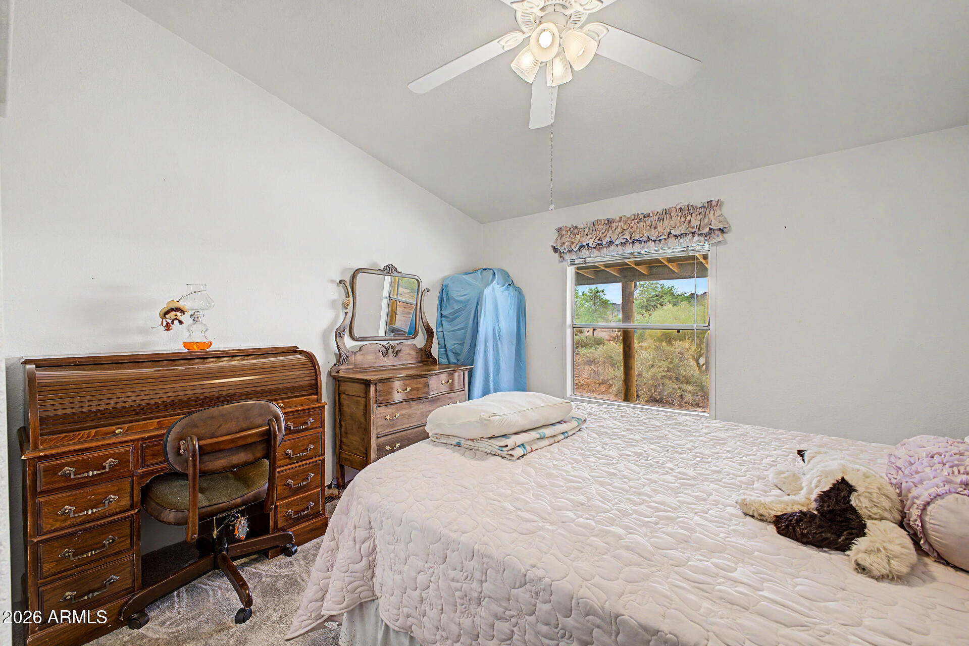 2548 South Val Vista Road Apache Junction, AZ 85119 - Photo 27 of 29 a bedroom with a bed and a chandelier