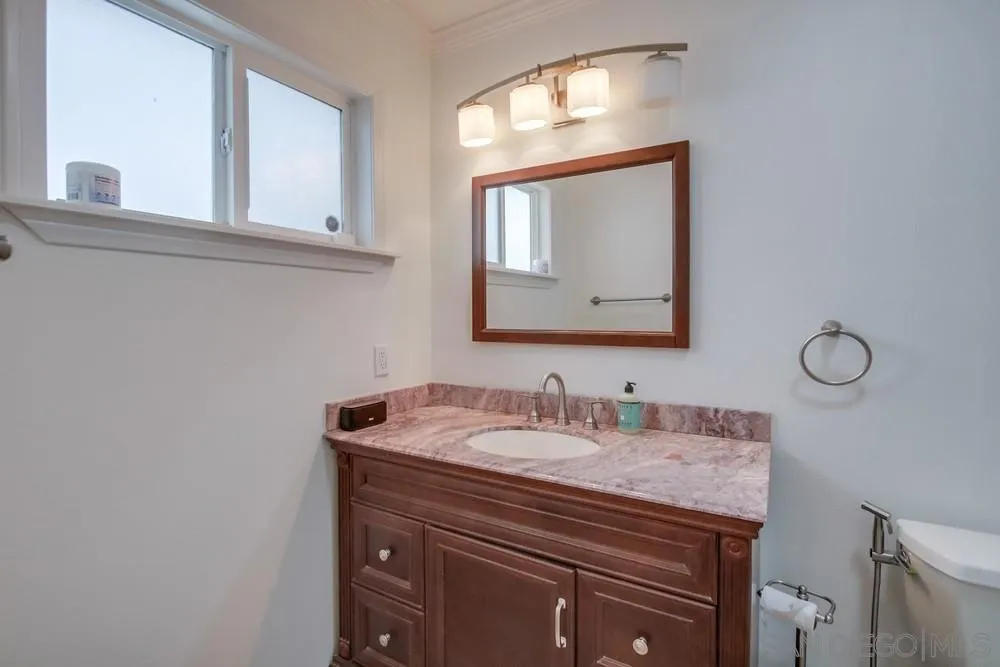 10520 El Nopal Santee, CA 92071 - Photo 13 of 34 a bathroom with a sink vanity and mirror