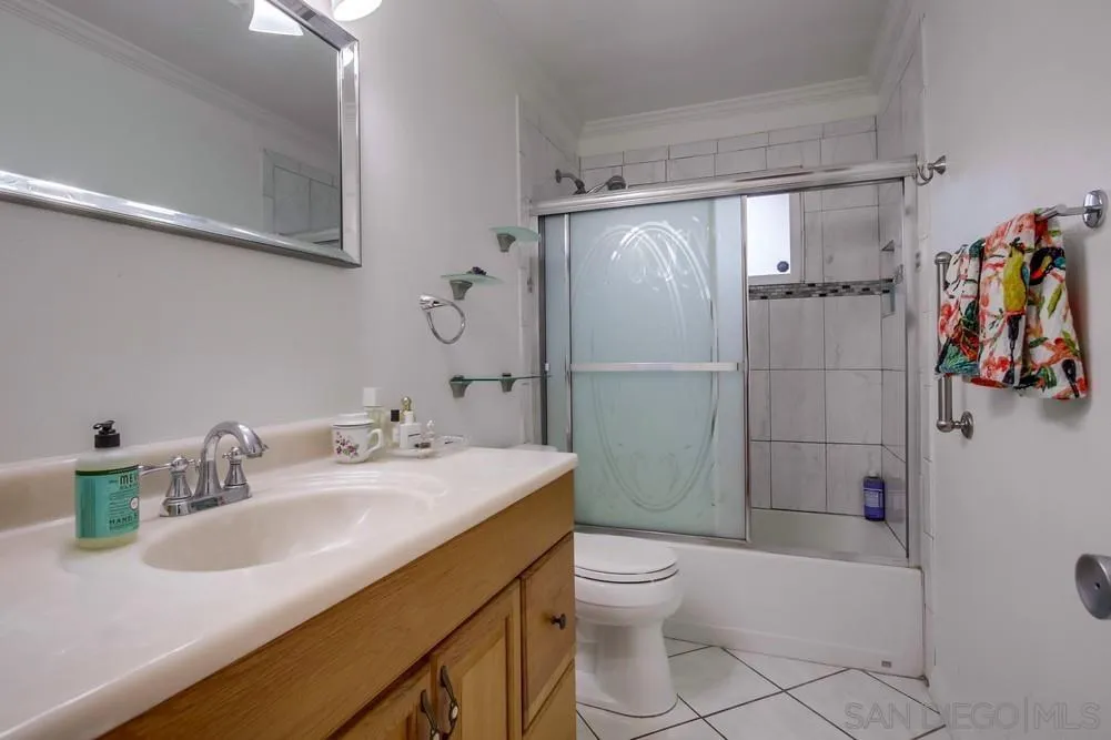10520 El Nopal Santee, CA 92071 - Photo 16 of 34 a bathroom with a sink a toilet and shower