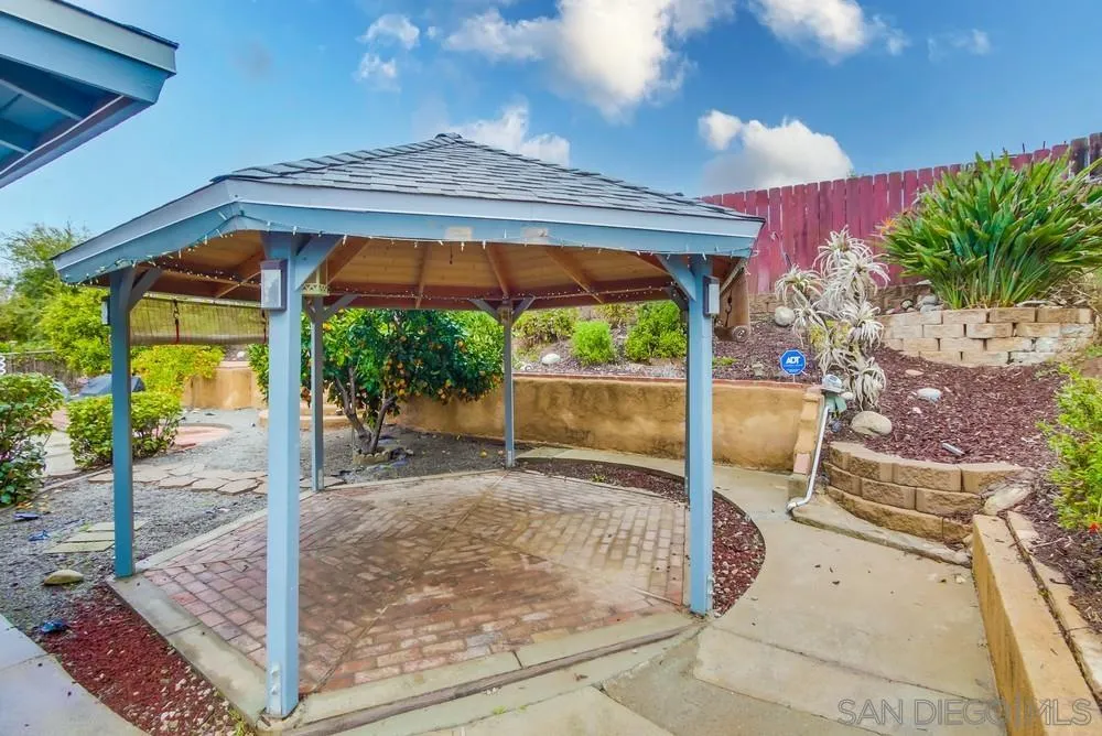 10520 El Nopal Santee, CA 92071 - Photo 24 of 34 a backyard of a house with fountain table and chairs
