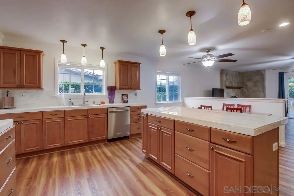 10520 El Nopal Santee, CA 92071 - Photo 3 of 34 a large kitchen with a lot of counter space and wooden floor