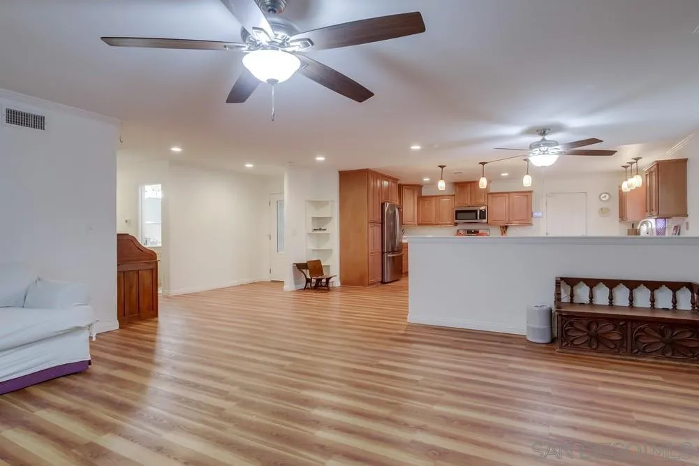 10520 El Nopal Santee, CA 92071 - Photo 6 of 34 a view of a living room a kitchen and a chandelier fan