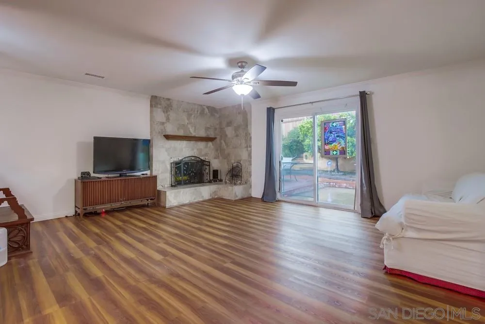 10520 El Nopal Santee, CA 92071 - Photo 8 of 34 a living room with furniture and a flat screen tv