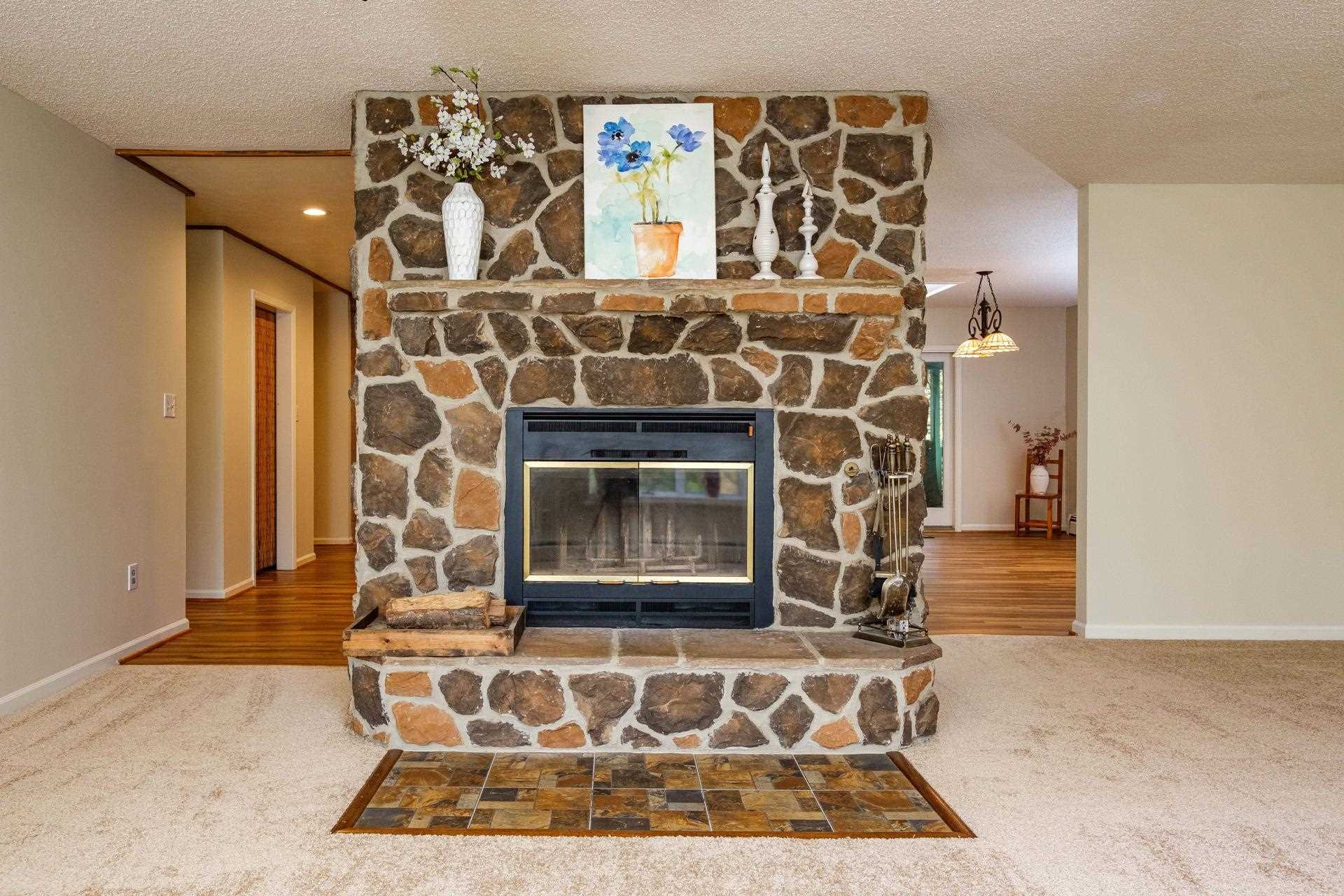 3878 Shutterlee Mill Road Staunton, VA 24401 - Photo 12 of 63 a living room with a fireplace and a rug