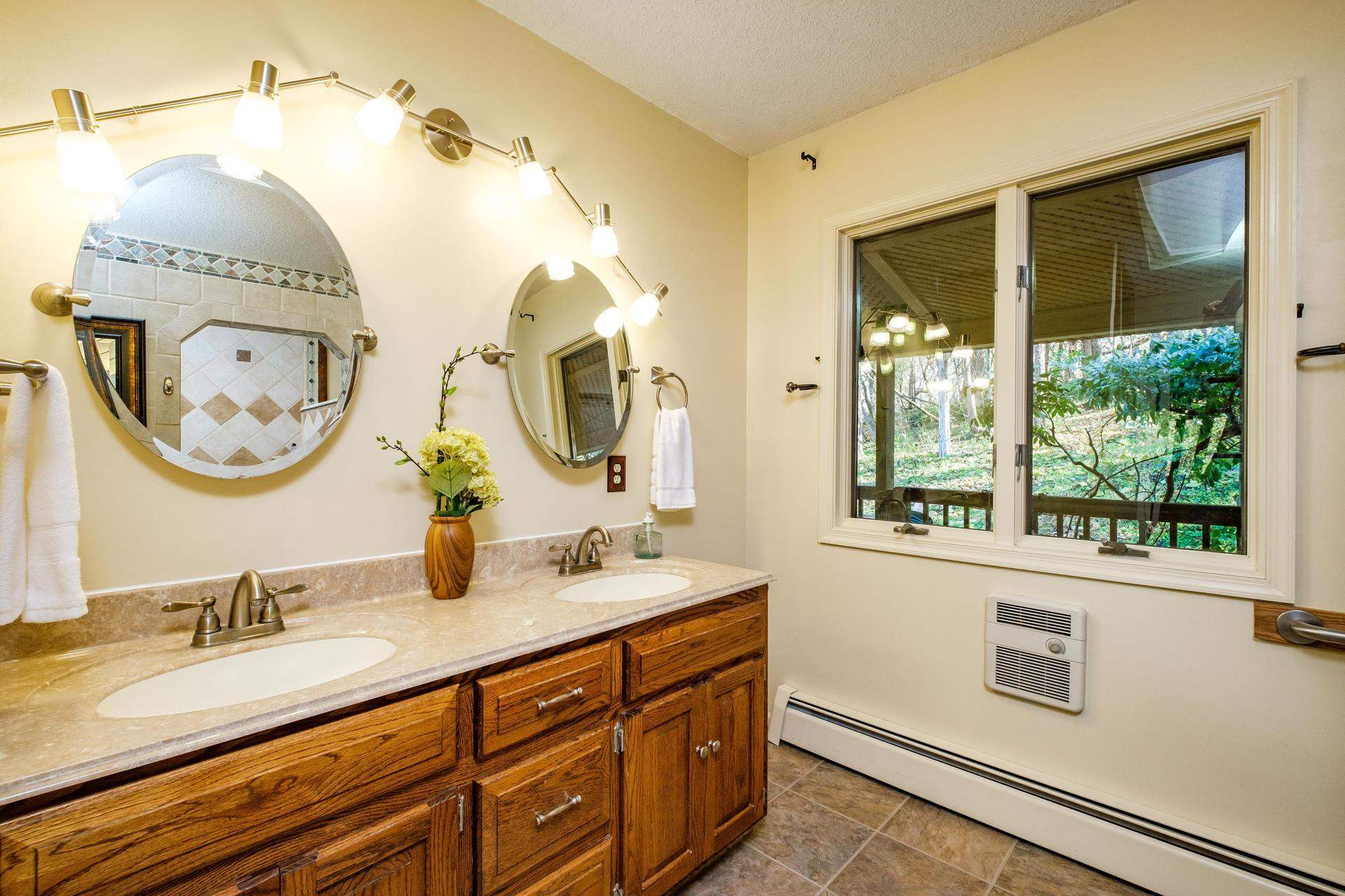 3878 Shutterlee Mill Road Staunton, VA 24401 - Photo 16 of 63 a bathroom with a granite countertop double vanity sink and a mirror