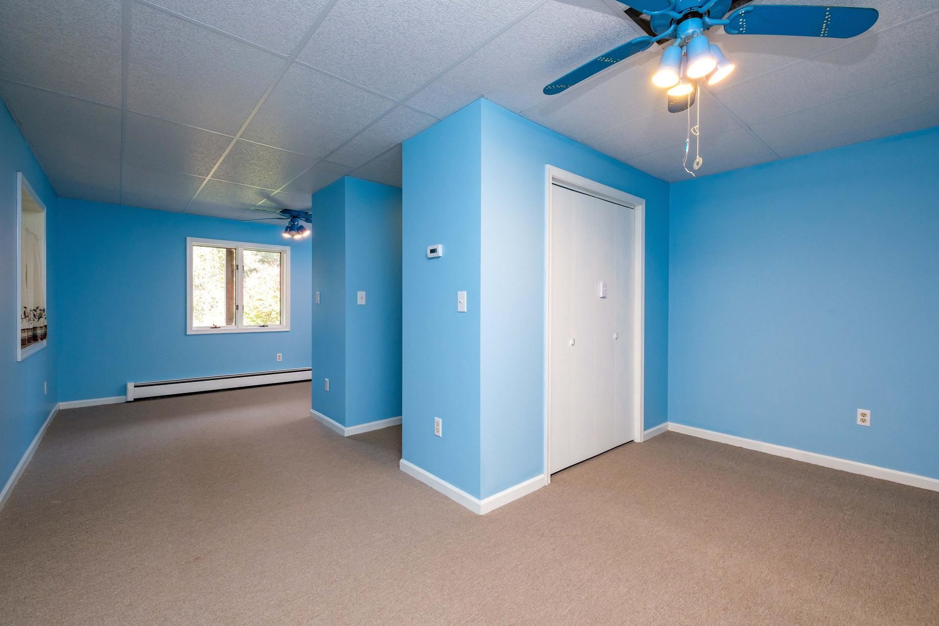 3878 Shutterlee Mill Road Staunton, VA 24401 - Photo 20 of 63 an empty room with windows and fan