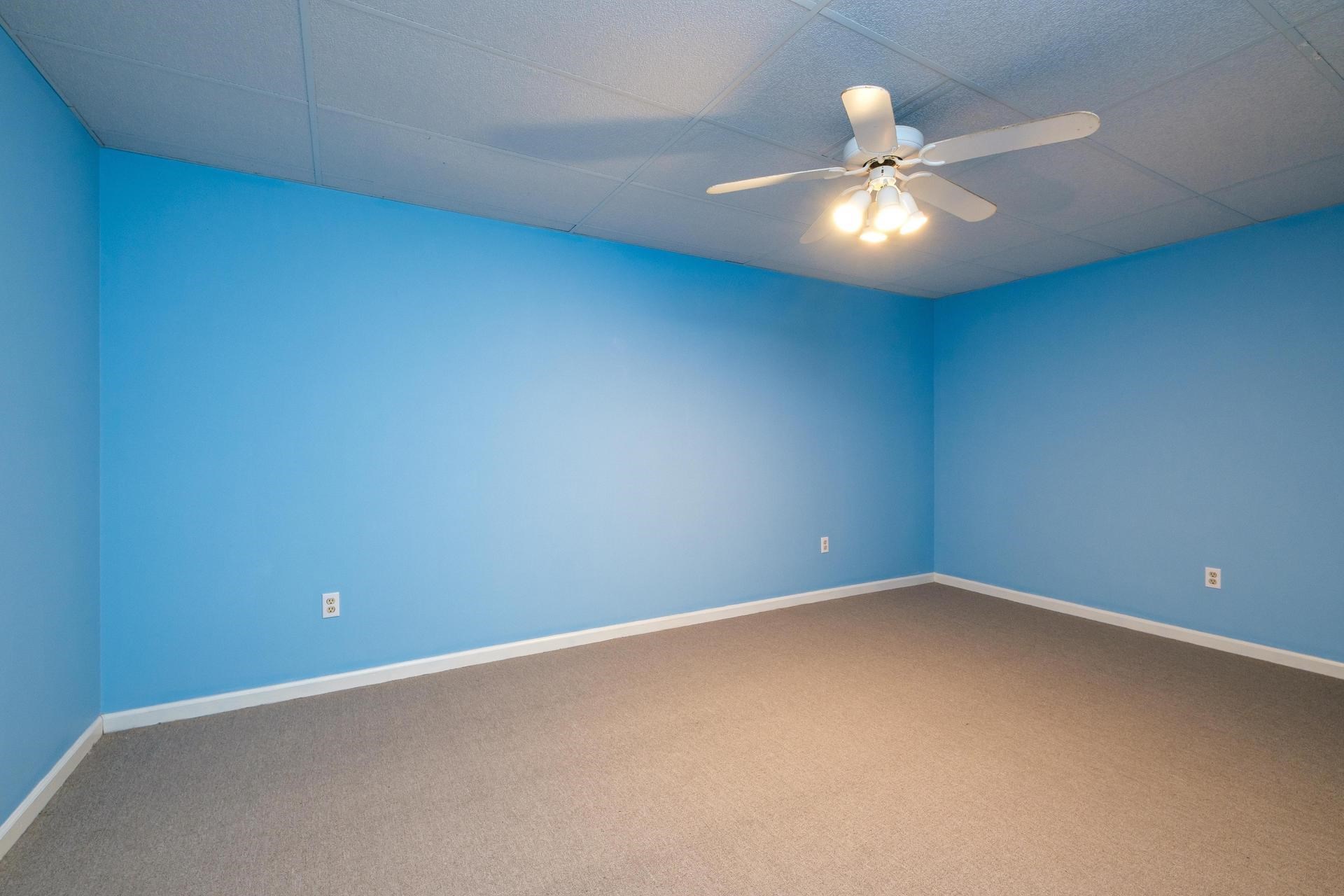 3878 Shutterlee Mill Road Staunton, VA 24401 - Photo 21 of 63 an empty room with a ceiling fan and window