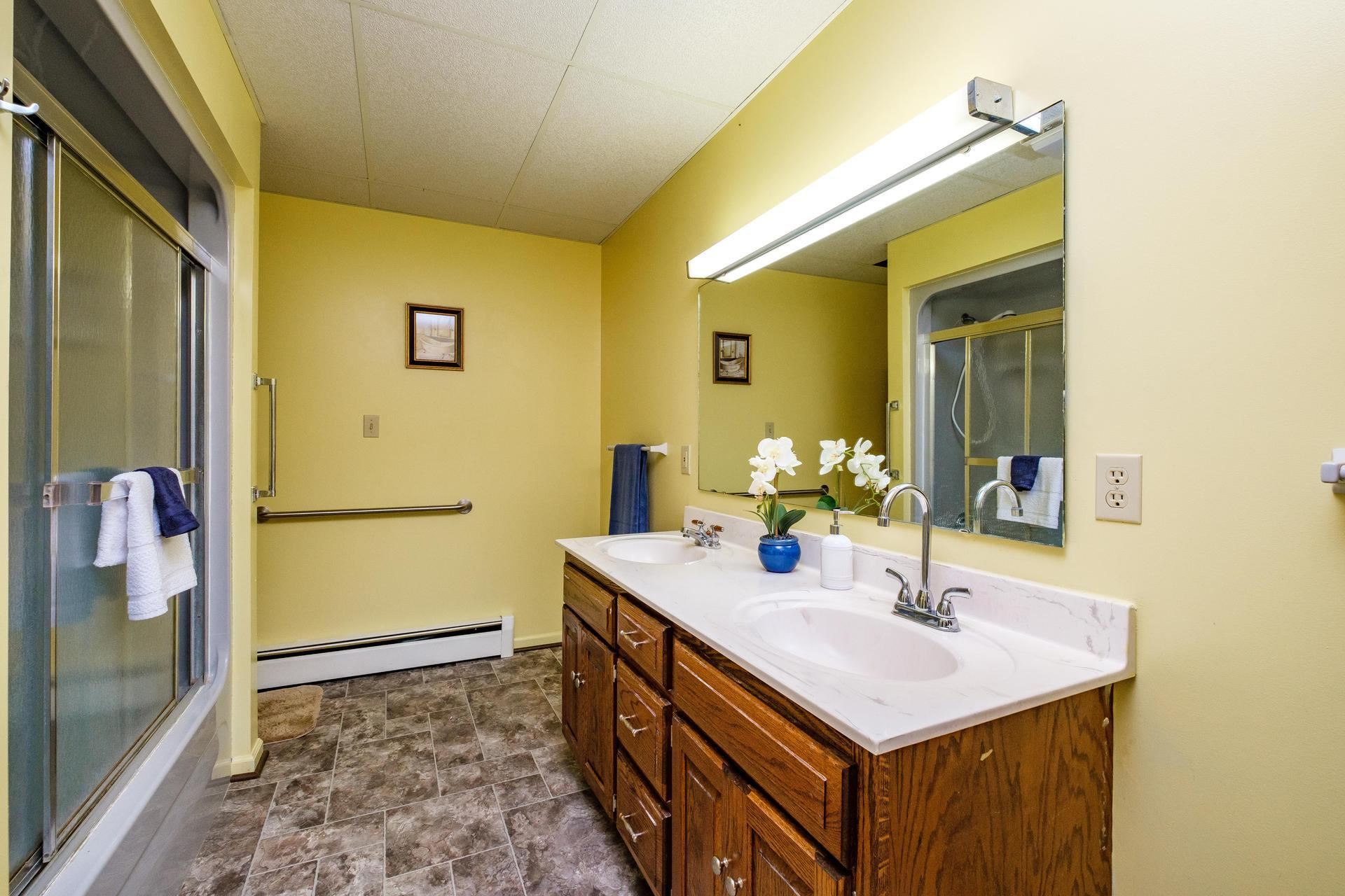 3878 Shutterlee Mill Road Staunton, VA 24401 - Photo 22 of 63 a bathroom with a sink and a mirror
