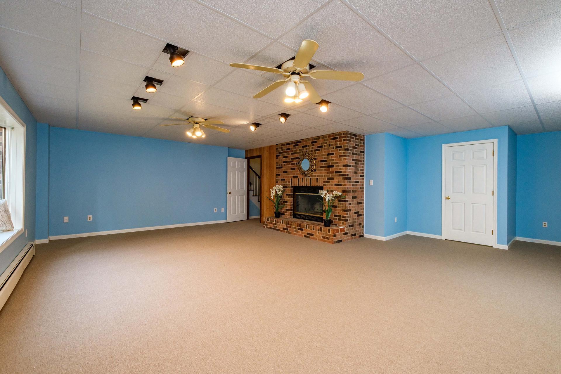 3878 Shutterlee Mill Road Staunton, VA 24401 - Photo 24 of 63 an empty room with chandelier fan and windows