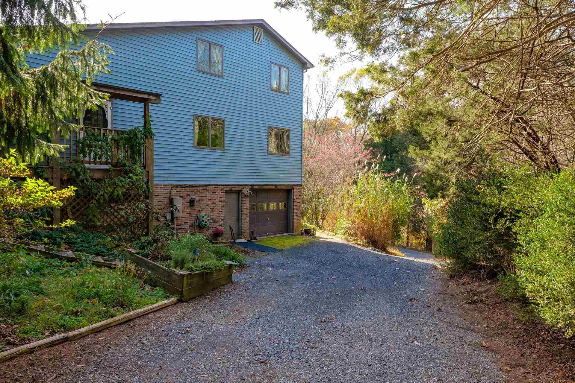 3878 Shutterlee Mill Road Staunton, VA 24401 - Photo 27 of 63 a front view of a house with garden