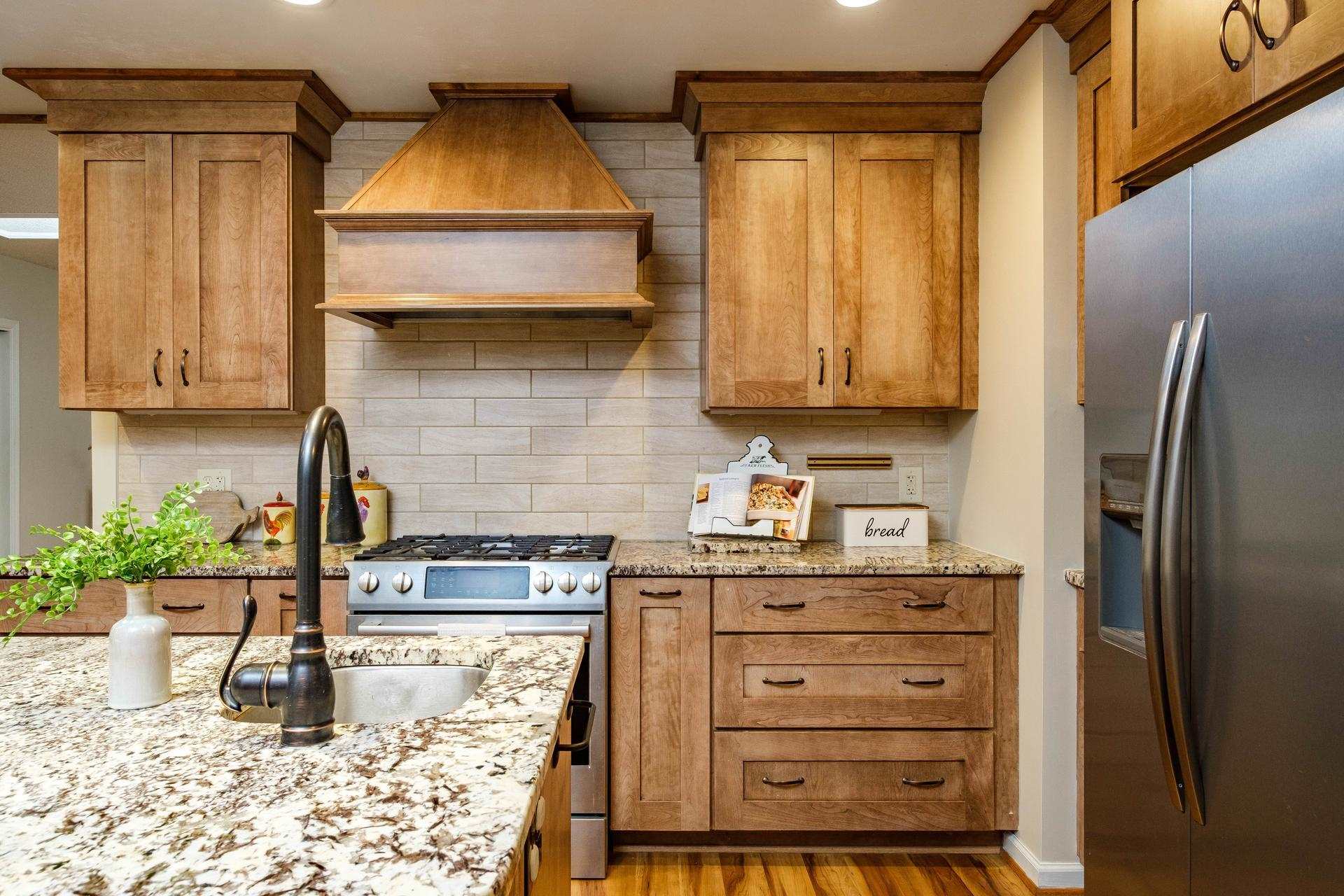 3878 Shutterlee Mill Road Staunton, VA 24401 - Photo 3 of 63 a kitchen with granite countertop a refrigerator and a stove top oven