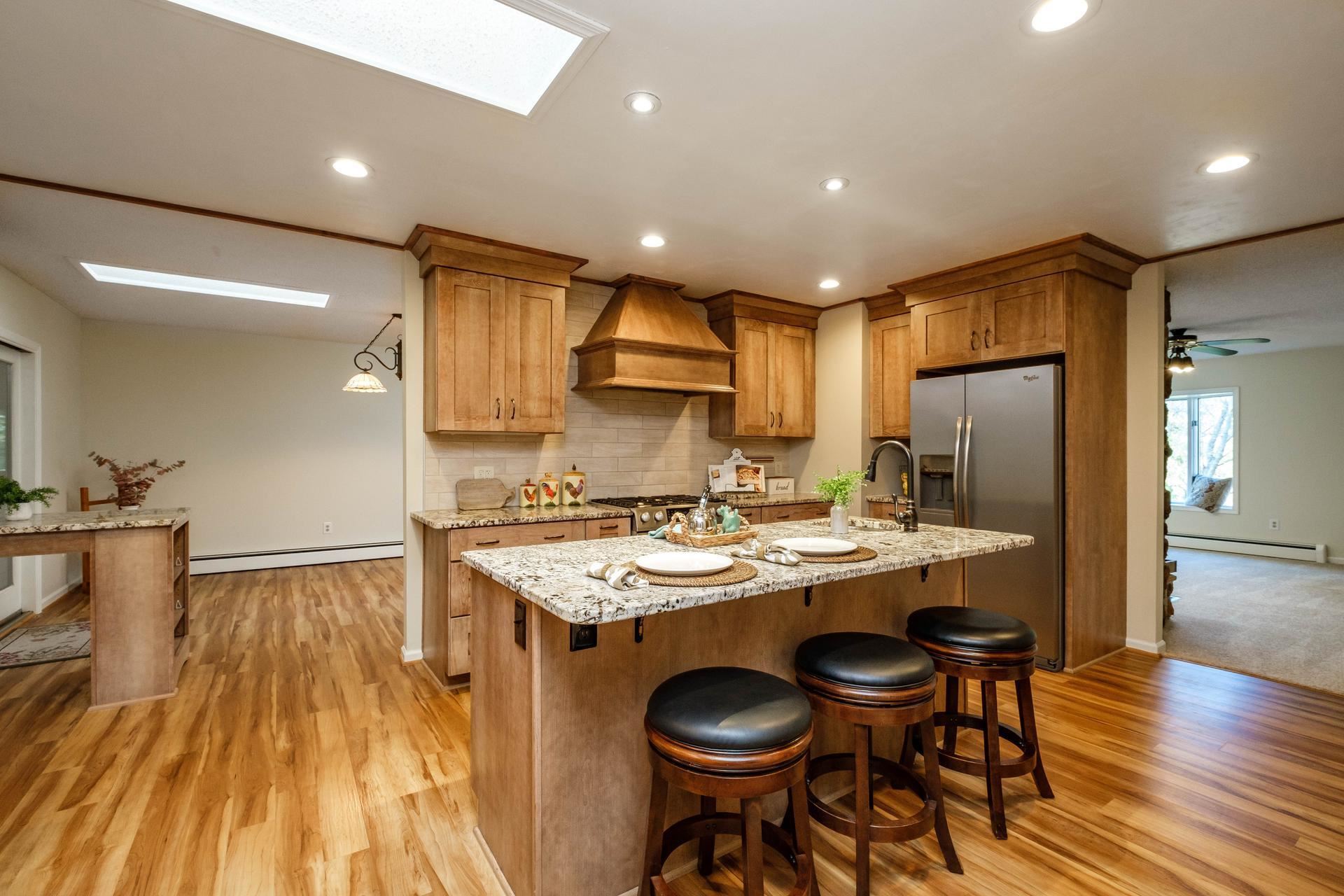 3878 Shutterlee Mill Road Staunton, VA 24401 - Photo 6 of 63 a kitchen with a sink a stove a refrigerator and chairs