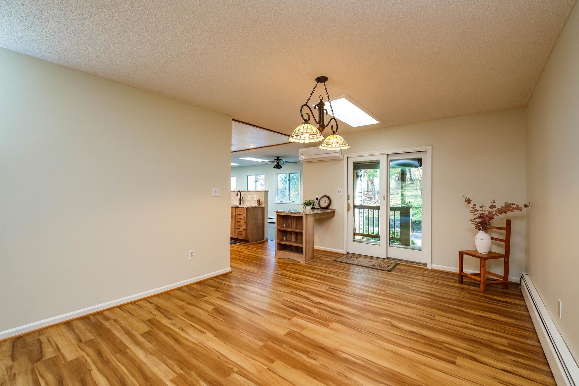 3878 Shutterlee Mill Road Staunton, VA 24401 - Photo 7 of 63 a view of a livingroom with wooden floor and furniture