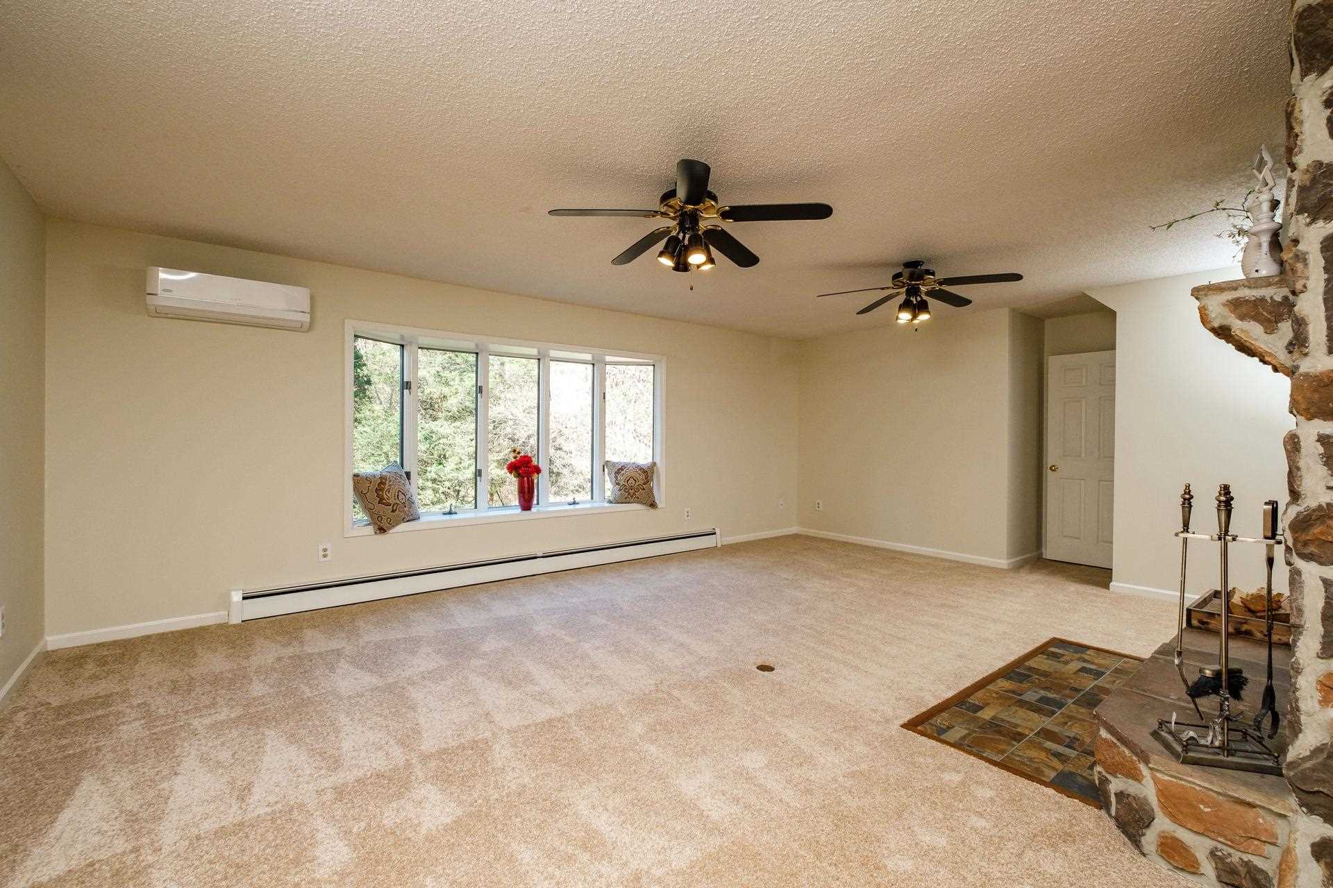 3878 Shutterlee Mill Road Staunton, VA 24401 - Photo 10 of 63 a view of a livingroom with a furniture wooden floor and a chandelier