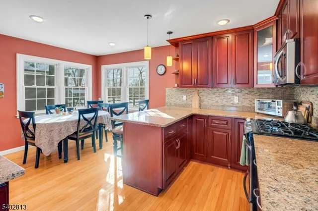 a view of a house with snow on the road