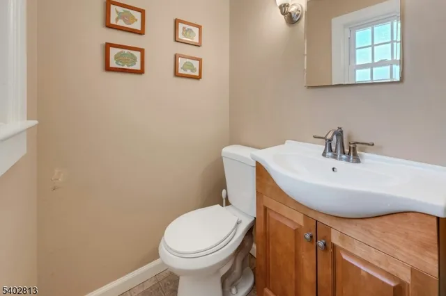 a front view of a building with snow on the road